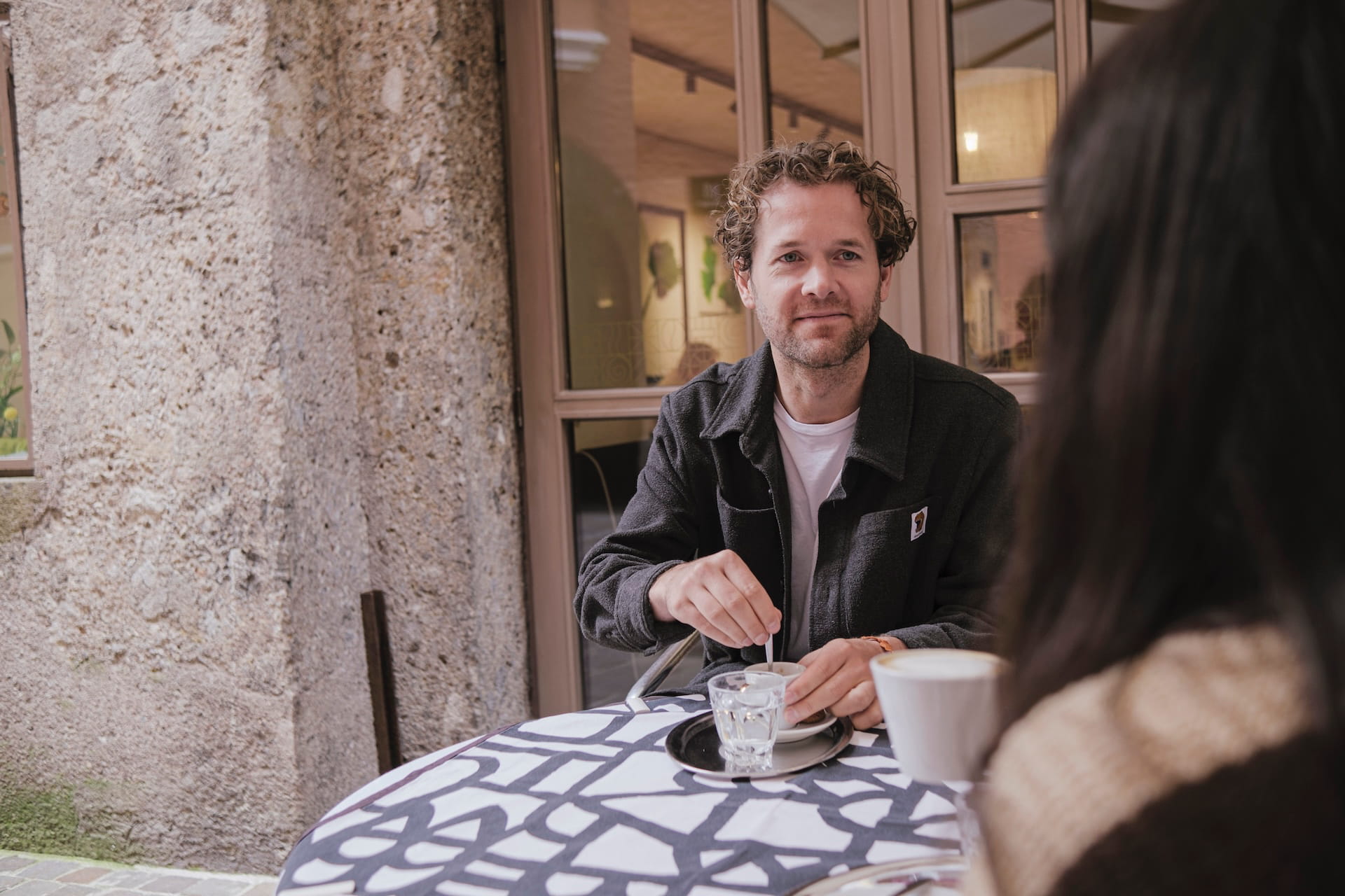 picture of Zack discussing over coffee
